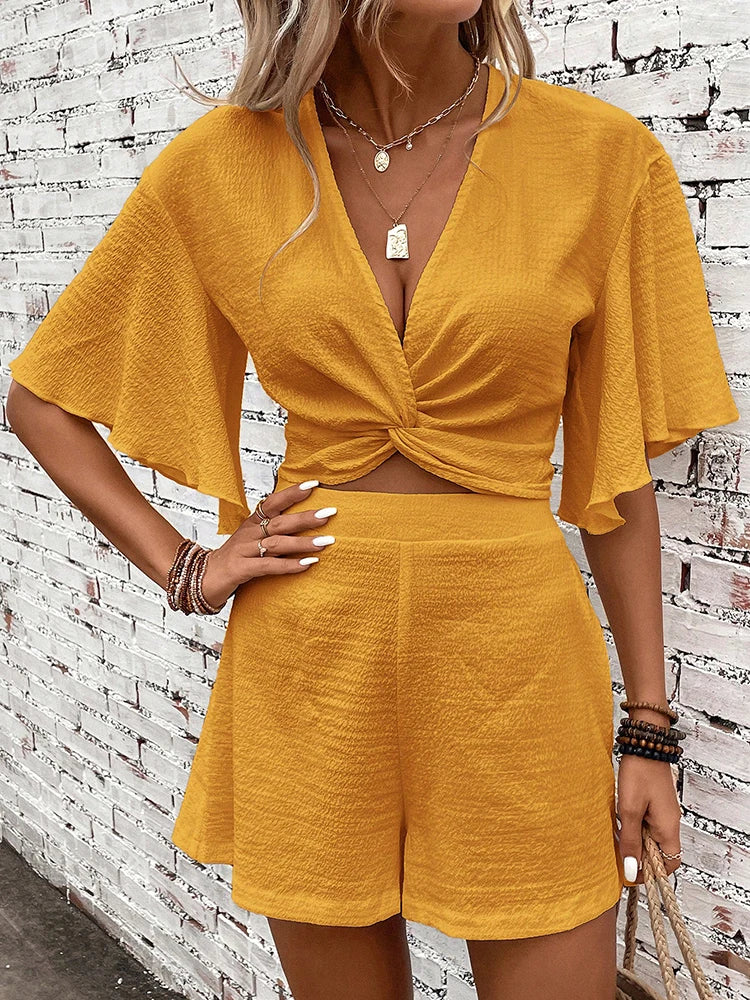 Vasilina - Elegante conjunto de top y pantalón corto con cuello de murciélago en V profunda